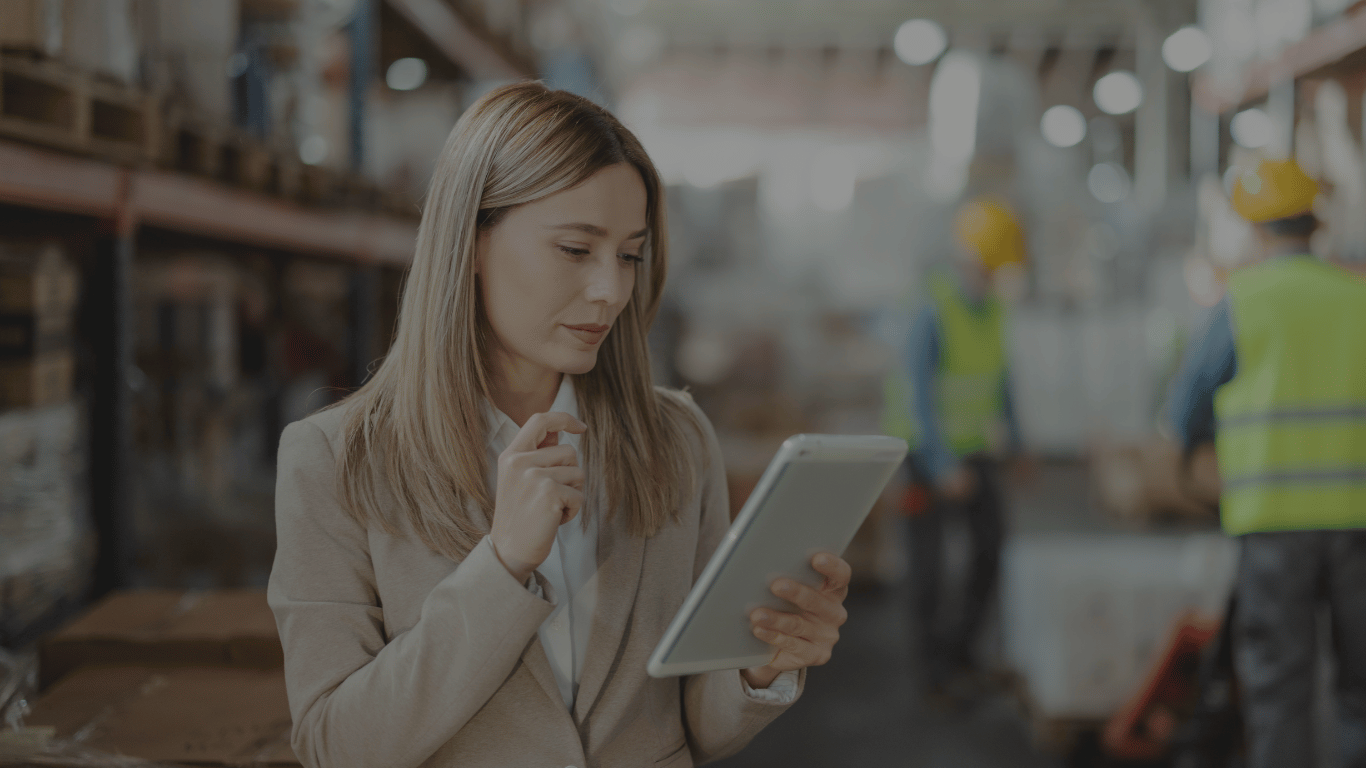 Professional warehouse setting with a ShiftB2B consultant leading digital transformation in a legacy B2B operation.